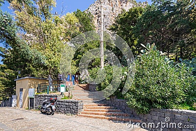 Cefalu, Italy - March 24, 2019: Entrance to Rocca di CefalÃ¹, stairs leading to the pathway to hill top - Cefalu, Sicily Editorial Stock Photo