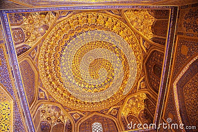 Ceiling decorated with gold and ornamentation inside Tillya-Kori, Sherdor, Ulugbek madrasah on Registan Square in Smarkand in Editorial Stock Photo