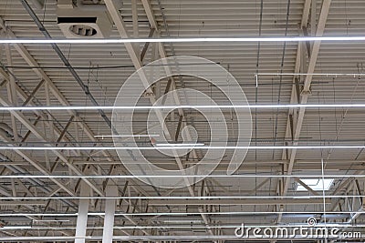Ceiling of industrial building with LED lamps and ventilation window in shopping center or warehouse Stock Photo
