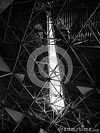 ceiling with metal structures in a modern building - geometry in architecture. Stock Photo