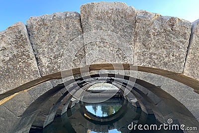 Ceiling ruins of ancient stone temple of Apollon in Klaros ancient city filled water Stock Photo