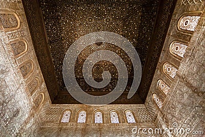 Ceiling and walls with Islamic calligraphy and patterns, the 14th century palace of Alhambra Editorial Stock Photo