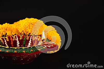 Celebrate Indian Festival Diwali, A beautifully crafted Diwali lamp and intricate flower rangoli Stock Photo