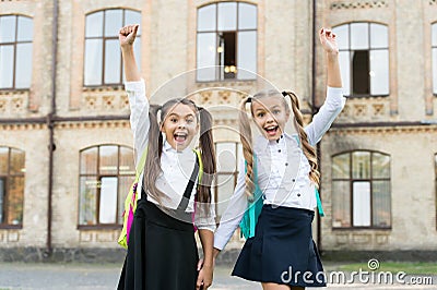 Celebrate last day of school year. Happy children celebrate outdoors. Celebrate school holidays. Small schoolgirls enjoy Stock Photo
