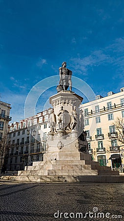 Sunny Serenity - Statue in a Tranquil Praça Luís de Camões Editorial Stock Photo