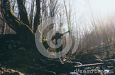 Celebrating Freedom happy woman feeling alive and free arms raised up to sky,positive girl in a river in the forest Stock Photo