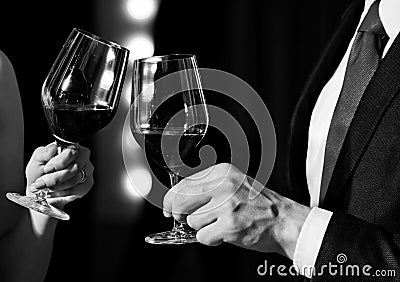 Celebrating success. cheers, couple clink glasses with red wine Stock Photo