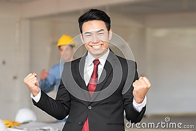 Celebrating success with excited young businessman Stock Photo
