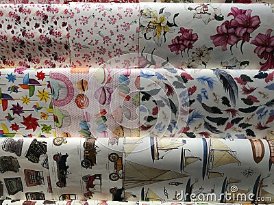 Celebration boxing day with 9 variety colorful collection gift wrapping paper from left to right Editorial Stock Photo