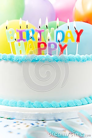 Celebration Cake With Candles Spelling Happy Birthday Stock Photo