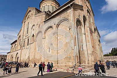 Celebration of City Day in crowd near the historical christian Svetitskhoveli Cathedral, UNESCO World Heritage Site. Editorial Stock Photo