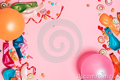 Celebration Flat lay. Candy with colorful party items on pink ba Stock Photo