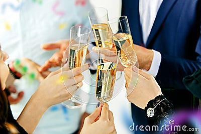 Celebration. Hands holding the glasses of champagne and wine making a toast. Stock Photo