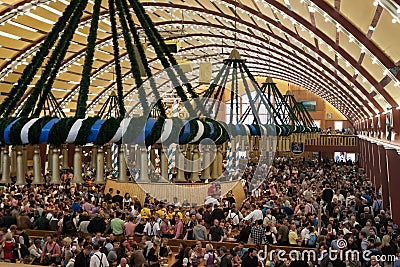 Celebration at the Oktoberfest inside a bavarian tent Editorial Stock Photo