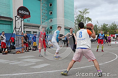 Russia, Murmansk-June 24, 2018: celebration of Russian youth Day, boys play street basketball Editorial Stock Photo