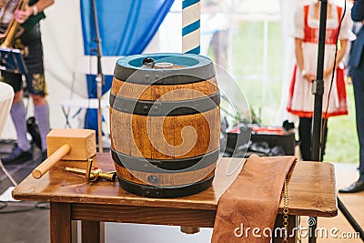 Celebration of the traditional German beer festival Oktoberfest. The beer barrel is a holiday symbol before its breaking Stock Photo