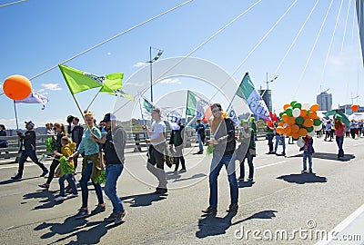 A celebratory parade in honor of the first Maya. people walk on the bridge Editorial Stock Photo