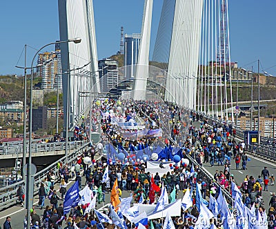 A celebratory parade in honor of the first Maya. people walk on the bridge Editorial Stock Photo