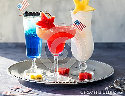 Celebratory 4th of July cocktails against a bright sunny window. Stock Photo