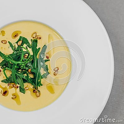 Celery cream soup with arugula Stock Photo