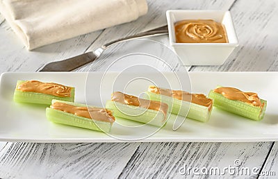Celery stalks with peanut butter Stock Photo