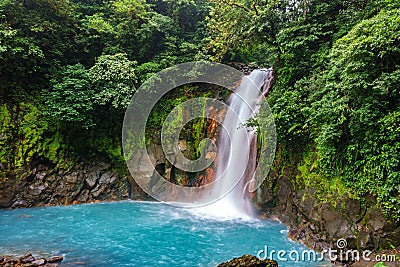 Celestial blue waterfall and pond in tenorio national park, Costa Rica Stock Photo