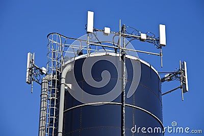 Cell antennas mounted on the top of the silo Stock Photo