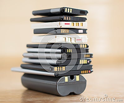 cell phone batteries. stacked. battery recycling. recovery of gold, lithium Stock Photo