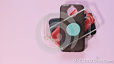 Cell phone, mobile case in a pink background. Cases it`s important to protect devices from falling down Stock Photo