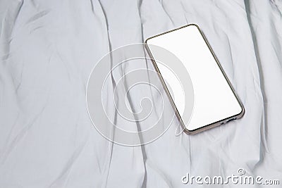 Cell phone on white bed in Interior train with copy space add text Stock Photo