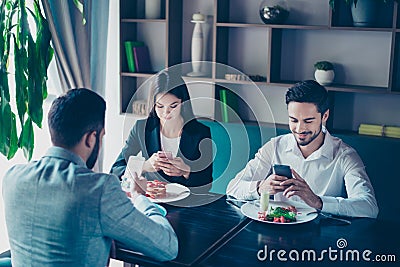 Cell phones addiction. New generation, busy people, lunch and me Stock Photo