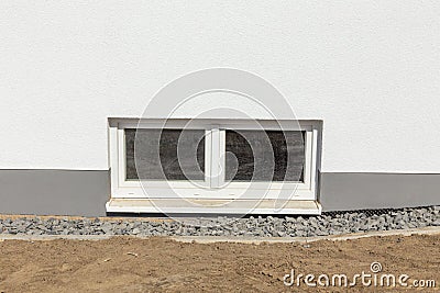 Cellar window at a new built family house with window sill Stock Photo
