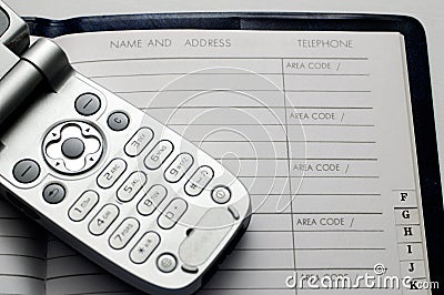 Cellphone and address book Stock Photo