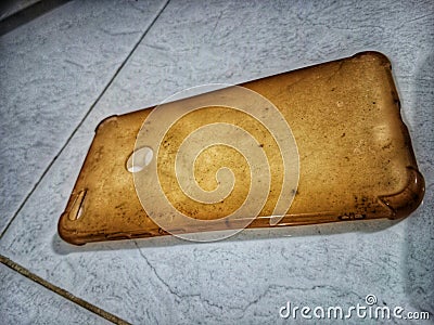 a cellphone case that hasn& x27;t been used for a long time, looks very dirty and dusty Stock Photo