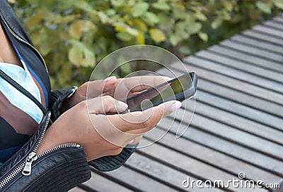 Cellphone in hands Stock Photo