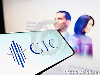 Cellphone with logo of Singaporean sovereign wealth fund GIC Private Limited on screen in front of web page. Editorial Stock Photo