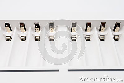 Cells with contacts for charging rechargeable batteries with selective focus and blurred background Stock Photo