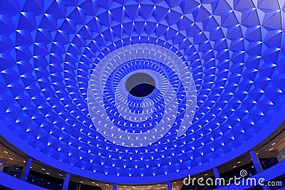 cellular ceiling lit up by blue led lighting Stock Photo
