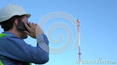 Cellular Engineer next to the Mast. Cell telecommunications Stock Photo