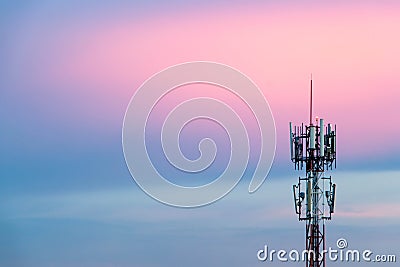 Cellular Signal Tower The background is sky in the evening, blue and pink. Stock Photo