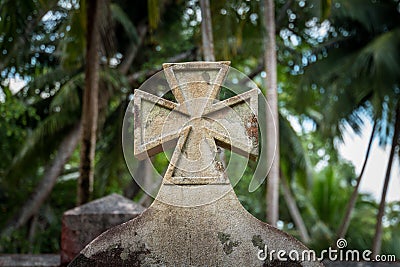 Celtic cross grave stone in foreground Stock Photo