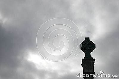 Celtic Stone Cross against grey sky Stock Photo