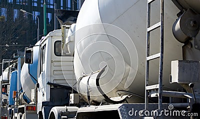Cement mixers waiting in row Editorial Stock Photo