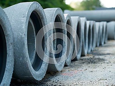 Cement pipes for sewerage rehabilitation in a row Stock Photo