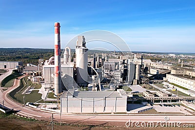 Cement plant with pipes. Ð¡ement production process and Industrial solution. factory with smoke pipe. Chimney smokestack emission Stock Photo
