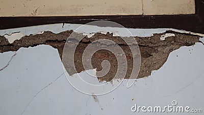 Cement wall collapse. Cracked concrete old wall. dangerous Stock Photo