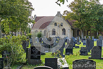 The cemetery next to the old Nicolaaskerk on the island of Vlieland Editorial Stock Photo