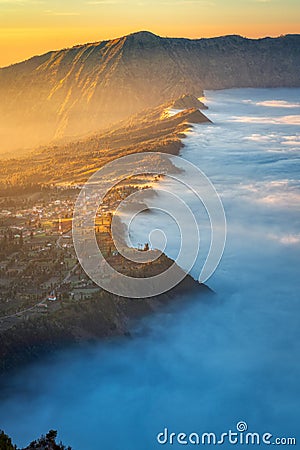 Cemoro Lawang village at Bromo volcano mountain in, East Java, Indonesia with beautiful sunrise and sea of fog Stock Photo