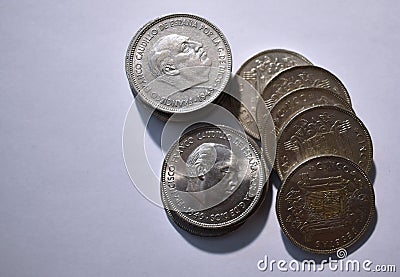 Cenital view of a pile of five peseta coins from 1949 and white background Stock Photo