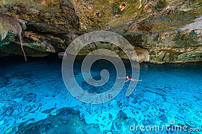 Cenote Dos Ojos in Quintana Roo, Mexico. People swimming and snorkeling in clear blue water. This cenote is located close to Tulum Editorial Stock Photo